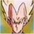 Pixelated close-up of a light-colored animal face with large ears and dark eyes, set against a blurred greenish-yellow background.