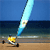 Pixelated static image of a yellow stick figure running on a beach with a large blue and white sail-like object against a blue sky and ocean background.