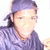 Pixelated image of a person with light skin wearing a purple headband and matching purple clothing, set against a white background.