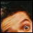 six pixelated close-up frames showing a person's face with changing expressions and partial text at the bottom