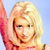 Static pixelated image of a person with blonde hair wearing red clothing against light blue background, likely from early 2000s digital art style.