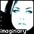 Pixelated image of a person with dark hair and light skin, featuring two side-by-side views showing subtle facial expression changes.