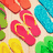 Colorful flip-flop icons arranged in a pattern on a light wooden background, with no visible motion changes