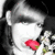 Pixelated close-up of a person with dark hair holding a red rose, white clothing, and a dark background.