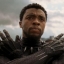 Static 64x64 pixel icon showing a person in dark clothing with raised hands against a cloudy sky background, rendered at higher resolution for review.