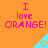 Pixelated orange background with pink text reading "I love ORANGE!" and light blue triangles containing small heart symbols.