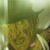 Static 50x50 pixel icon showing a blurry green and yellow figure with indistinct facial features against a light background.