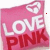 A static pink square icon with white and red text reading 'LOVE PINK' and a small heart symbol in the top-right corner.