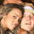 Pixelated static image of two people in close proximity with indistinct facial features and background elements.