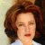 A pixelated image of a person with brown hair and light skin, next to green text reading 'Original Icons .com' on a dark background.