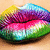 Pixelated lips with rainbow gradient colors on a light brown background, showing no text or additional elements.