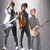 Four distinct pixelated images arranged in a : band members, red abstract shapes with text, black-and-white portrait with green text, and empty space