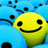 Yellow smiley face with black eyes and mouth surrounded by blue circular shapes with black dots.