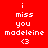 Red background with white pixelated text reading 'i miss you madeleine <3' in two identical vertical , each containing the same text sequence in the same order