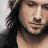 A pixelated contact sheet showing two frames of an animated icon featuring a person with long dark hair and the text "keith urban" in stylized black lettering on a gray background.