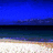 Pixelated beach scene with blue sky, dark water horizon, and sandy shore; white text 'paradise<3' in bottom-right corner.