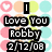 A static image with a of pastel-colored circles and hearts overlaid by black text reading "I Love You Robby 2/12/08"