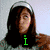 Animated image of a person with long dark hair wearing a silver headband, with a green lowercase 'i' overlaid on the chest area.