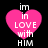 Four identical pink heart-shaped icons with white text reading 'im in love with him' on a black background, arranged in two of two