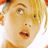 Static 48x48 pixel icon showing a close-up of a person's face with blonde hair, visible eyes, nose, mouth, and partial ear against white background.