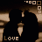 Pixelated static icon with brown and black tones featuring a central dark shape, beige geometric elements in the corners, and the word "LOVE" at the bottom left.