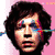 Pixelated static image of a person's face with dark curly hair against a pink background, featuring visible digital artifacts and color bleeding.