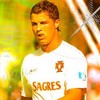 A person in a white sports jersey with orange text and logos stands against a blurred background with yellow and green tones.