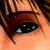 Pixelated character headshots and logo from The Sims 2 Limited Edition Bonus DVD, showing brown hair, light skin tones, and a stylized 'Sims 2' text with green accent.