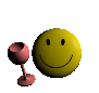 Yellow smiley face with black eyes and mouth next to a pink wine glass on a gray background.
