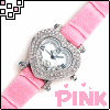 Pink wristwatch with heart-shaped clock face and diamond-like embellishments, displayed on white background with pink text.