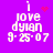 Purple background with white pixelated text reading "i love dylan 9-25-07" and animated red heart or star symbols changing position above the 'i'.
