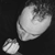 A grayscale pixelated icon shows a large rounded shape with internal lines and a smaller circular shape below it on dark background.