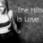 A grayscale pixelated image shows a partial figure with a raised hand and the text 'The FHB is Love' in blocky letters against a textured background.