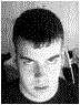 Three grayscale pixelated images of a person with short dark hair in different poses against a light background.