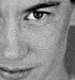 Black-and-white close-up of a person's face showing eye, nose, and mouth with subtle shading on the right side.