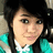 Pixelated portrait of a person with dark hair and teal clothing against a light background.