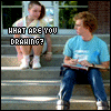 Six- shows two people on steps with changing text overlays; one person wears a blue shirt and jeans, the other a tie-dye top and white shoes