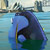 Pixelated static image of a blue and green cartoon fish with yellow accents against a light blue water background, likely from an animated film or game.