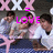 Three figures in white shirts and dark pants stand in a row with arms crossed, overlaid with bright pink text reading "LOVE" and a small pink symbol above it.
