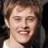 Static 48x48 pixel icon showing a close-up of a person's face with closed eyes and a slight smile, rendered in low-resolution pixel art style with visible dithering and color blending.