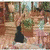 A pixelated animated scene shows a woman in a teal dress holding a black bag, standing on stone steps with greenery and buildings behind her.