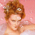 A 50x50 pixel animated buddy icon featuring a woman with styled hair and a white dress on the left, transitioning to green text reading "Original Icons .com" on a dark background on the right.