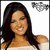 A pixelated image of a woman with long dark hair smiling, wearing an off-shoulder top against a white background.