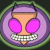 Pixelated circular icon featuring a cartoon character with large pink eyes, checkered mouth, purple headband, and green outer ring on dark background.