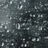 Pixelated black-and-white background with scattered white speckles, overlaid with pink pixelated text on a light blue field.