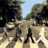 Pixelated static image of a figure walking on a path between trees with blue sky background, rendered in low-resolution 256x256 pixels.