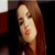 A split-screen image with a pixelated portrait on the left and red background text 'Gaga' with a star symbol on the right.