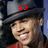 A person wearing a dark gray fedora and red shirt with text above the head changing from 'so' to 'sexy'.