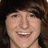 Pixelated image of a person with brown hair and a red background featuring text about Mitchel Musso and Taylor DeLaurenti.