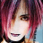 Pixelated close-up of a person with pink and purple hair, brown eyes, and light skin wearing dark clothing against a blue background.